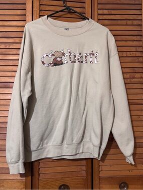 Women’s Cream Crewneck Sweatshirt with Cow Graphic